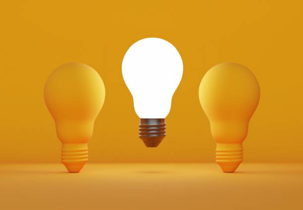 istock glowing light bulb and dim light bulbs on coloured background 2182929799