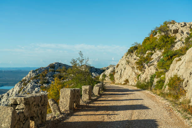 The Master's Road, half-asphalted, half-macadam 41-kilometer-long Majstorska cesta in Velebit.  One of the most beautiful tourist attractions in Croatia. Build 200 hundred years ago. Tula's crags are a karst formations on Velebit , their main feature tall pillars and towers, with long grooves carved through them.