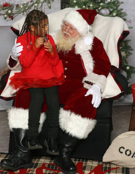 istock Little Girl Sitting on Santa's Lap 2182932042