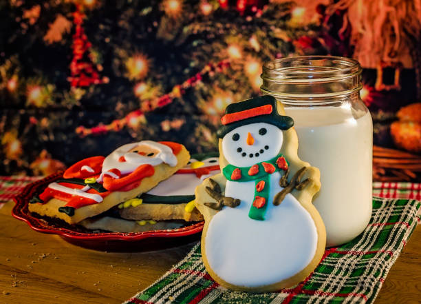 istock Christmas cookies beside Christmas tree 2182935502