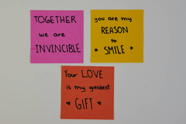istock Love text, written on sticky notes, isolated on white background 2182941681