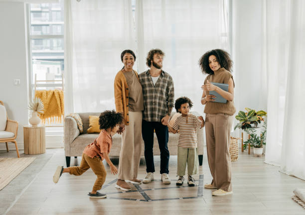 istock real estate agent showing new home to future owners 2182941965