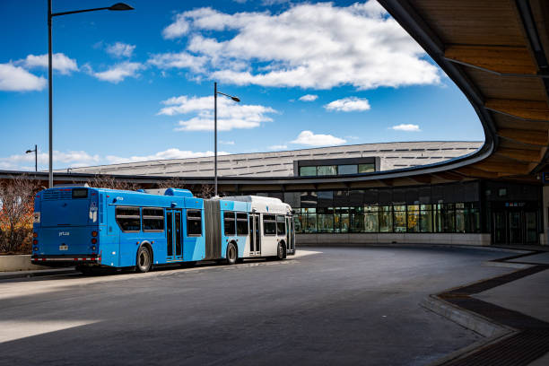 Brisbane, Australia - September 24, 2014: People wait for a bus  at a bus station in Brisbane, Australia. The CityGlider and CityCycle schemes reduce traffic congestion and improve public transport across Brisbane inner city.