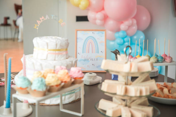 istock Whimsical Baby Shower Setup with Diaper Cake and Treats 2182945718
