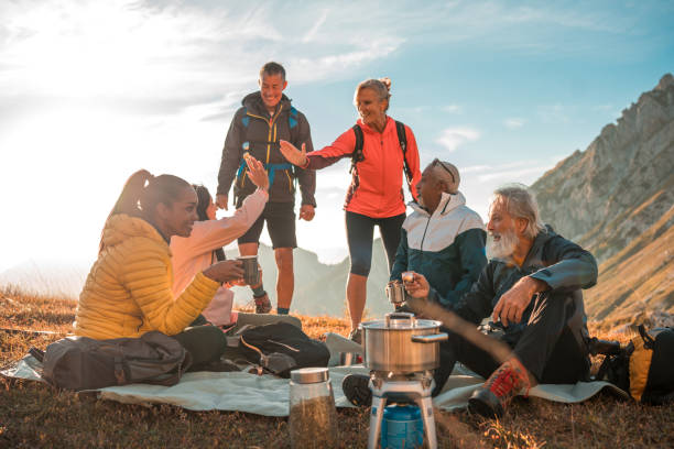 istock Hilltop Tea Pause with Diverse Hiking Friends 2182945809