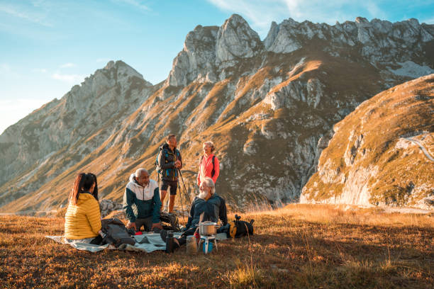 istock Diverse Friends Relaxing with Tea on Mountain Top 2182945811