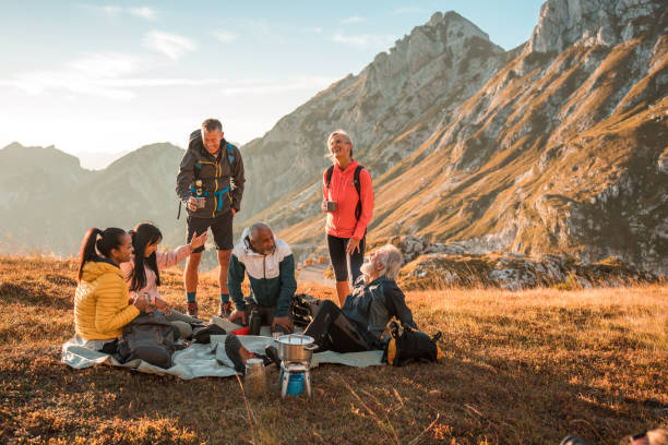 istock Diverse Friends Enjoying Fresh Air and Tea at Hill Summit 2182945813