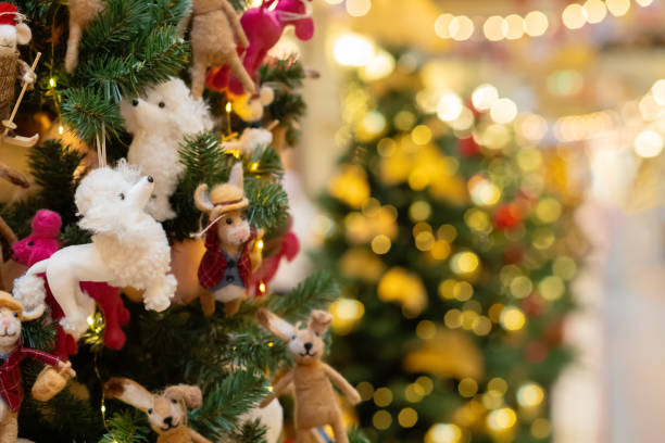 istock Christmas tree with cute felted wool toys, blurred background with glowing lights 2182948720