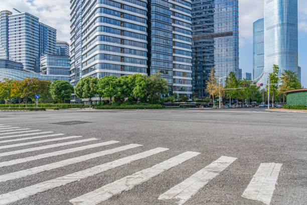 istock Empty road with zebra crossing and skyscrapers in modern city 2182962063