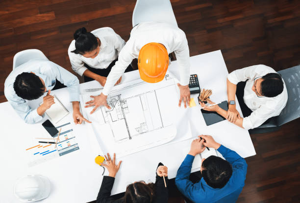 istock Diverse group of civil engineer and client working on architect. Prudent 2182964724