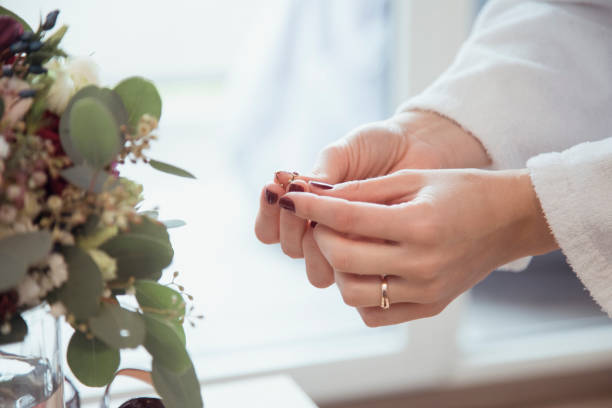 istock Bridal preparations for a wedding with elegant bouquet and wedding rings in a bright setting 2182967982