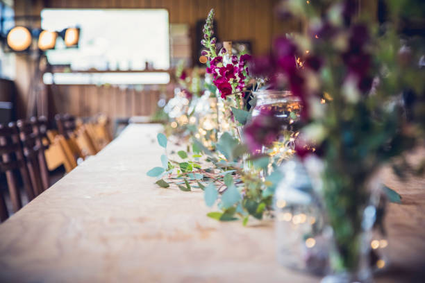 istock Elegant wedding reception table adorned with floral decorations and ambient lighting 2182968116