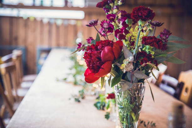 istock Elegant floral arrangement on a dining table at a wedding reception in a charming venue 2182968445