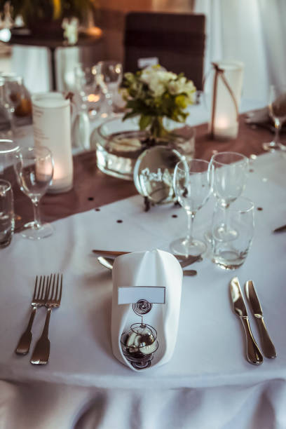 istock Elegant table setting with floral centerpiece for a wedding reception at sunset 2182969253