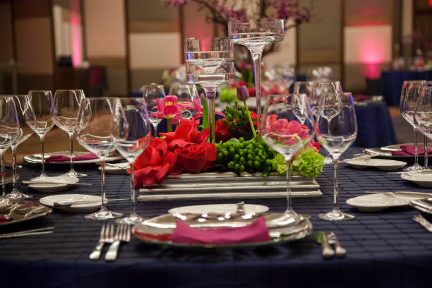 istock Elegant table setting adorned with flowers and fine diningware for a formal event 2182969547