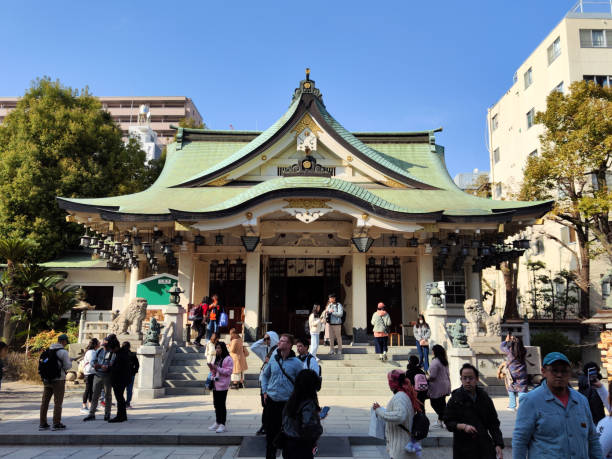 Tourists sightseeing the famous Nanba Shrine, a Shinto Shrine in Osaka, Japan