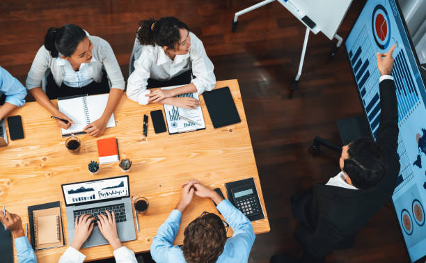 istock Wide top view diverse analyst team analyzing financial data. Habiliment 2182971450