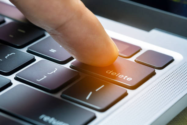 Finger of the computer user, he presses the delete button on the computer keyboard. Finger of the computer user, he presses the delete button on the computer keyboard. delete-key stock pictures, royalty-free photos & images