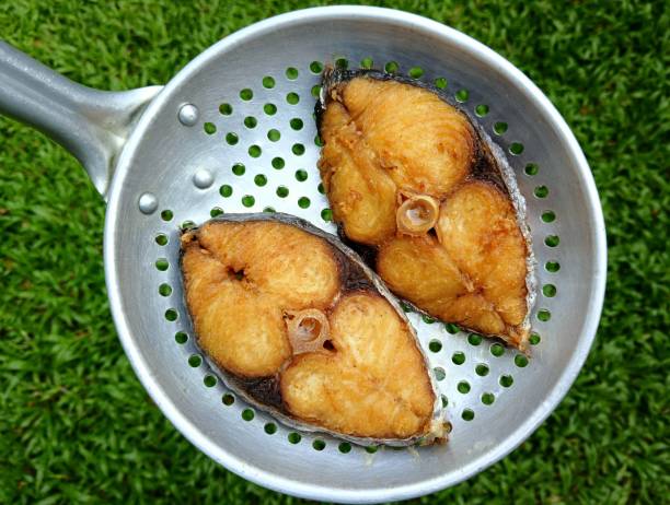 Cooking Deep fried King Mackerel Fish - food preparation.