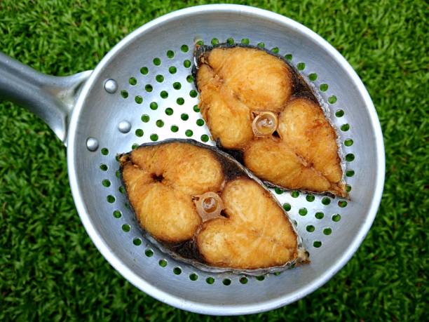 Cooking Deep fried King Mackerel Fish - food preparation.