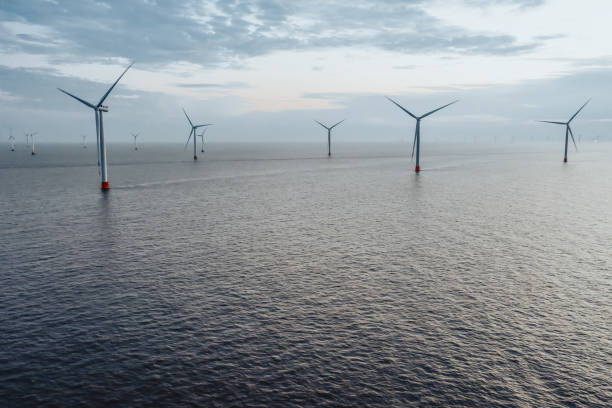 istock Aerial view of massive offshore wind turbines 2182982679