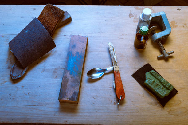 istock Old knife with spoon. Restoration of tools. Army knife with spoon. 2182983838