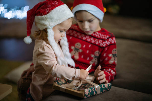 istock Boy and girl whit Christmas present 2182988584