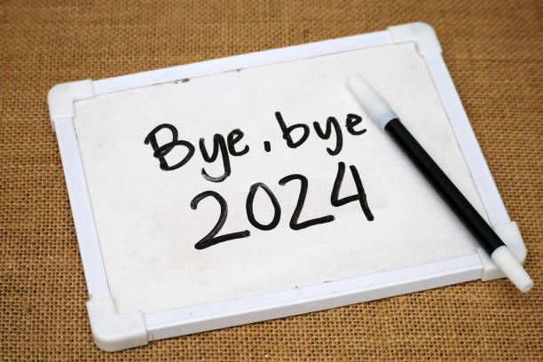 istock handwritten text Bye-bye 2024 on a whiteboard with pen 2182990633