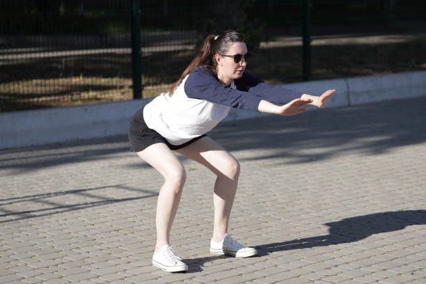 istock Woman exercising or doing workout session outside 2182990716