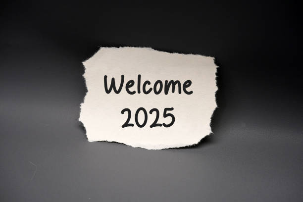istock Torn paper with the text Welcome 2025 on a black background 2182992354