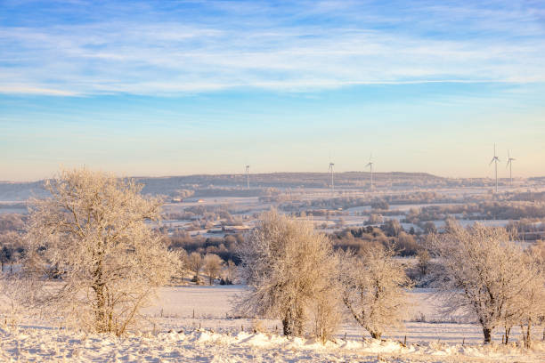 Wintry landscape view in the countryside with a wind farm