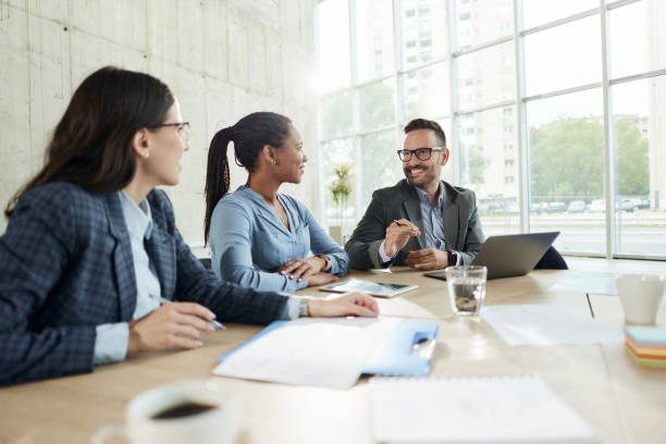 istock Happy business team talking on a meeting in the office. 2182995129