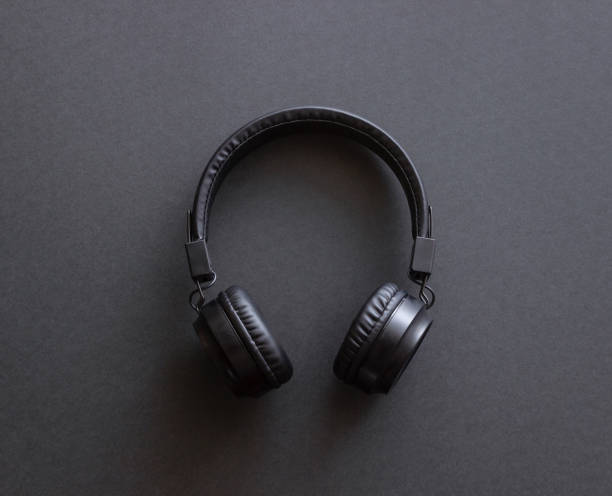 istock Black headphones on a black background. Minimal concept. Mock-up. Music. 2182996648