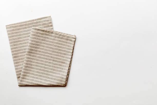 istock top view with gray kitchen napkin isolated on table background. Folded cloth for mockup with copy space, Flat lay. Minimal style 2182997060