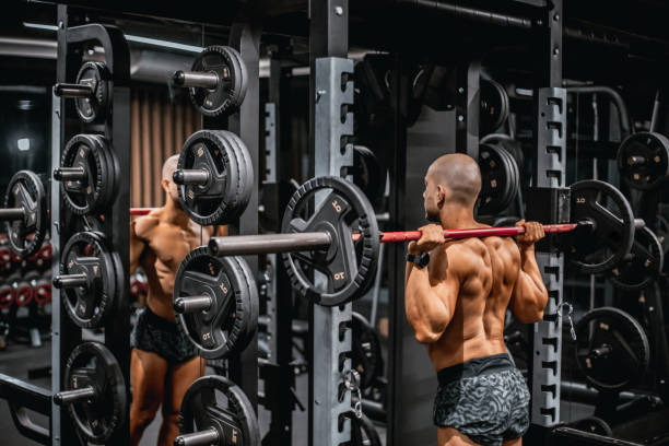 istock Young strong bodybuilder preparing to do squat in the gym 2182998387