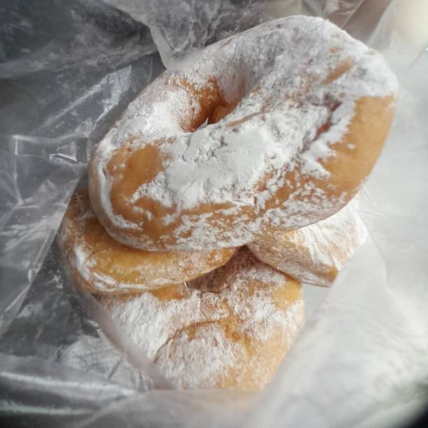 A classic sugar donut with a soft, fluffy texture and coated in a sweet layer of sugar. Perfectly simple yet satisfying, offering a delightful treat with every bite.