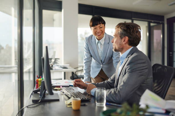 istock Happy diverse entrepreneurs working on desktop computer in the office. 2182998755