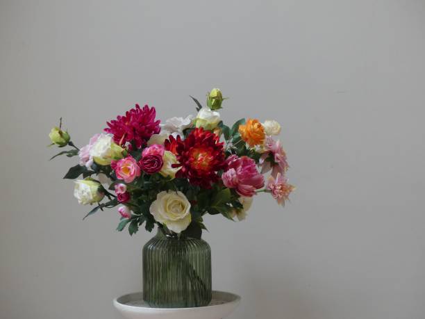 istock Vibrant bouquet in a green vase. 2183000621