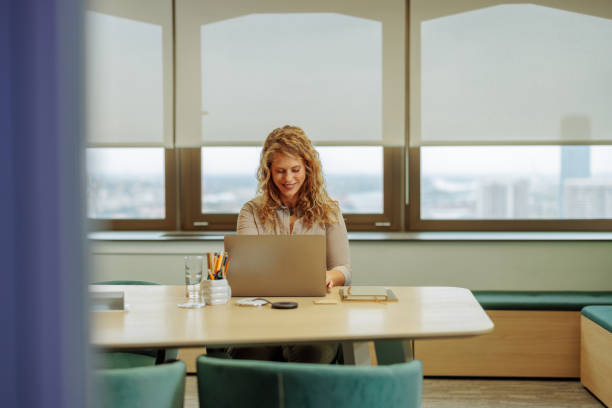 istock Businesswoman working in a modern office and smiling 2183004061