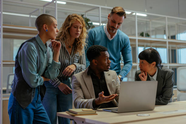 istock Employees, in a meeting, brainstorming ideas and deciding 2183004162