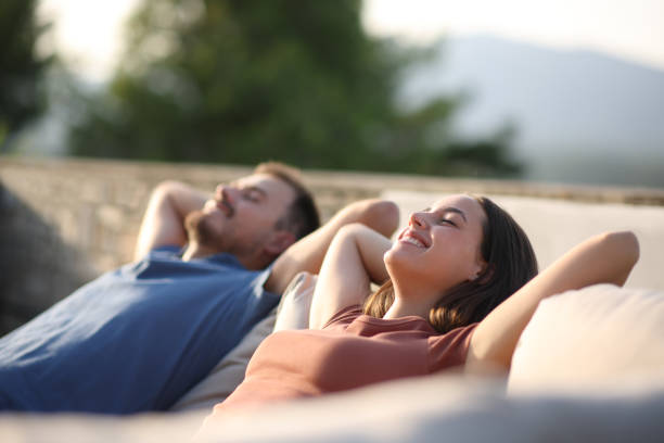istock Happy couple relaxing in a terrace sofa 2183009496