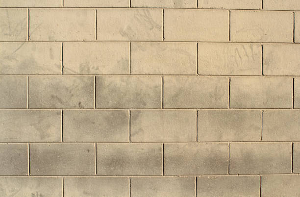 Beige concrete block brick wall abstract texture background