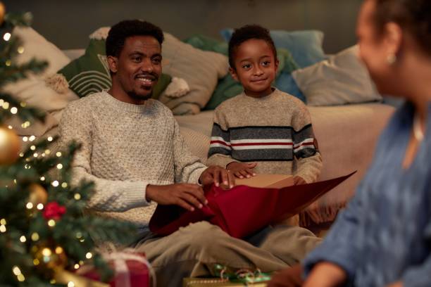 istock Father and Son Opening Gifts on Christmas 2183012764