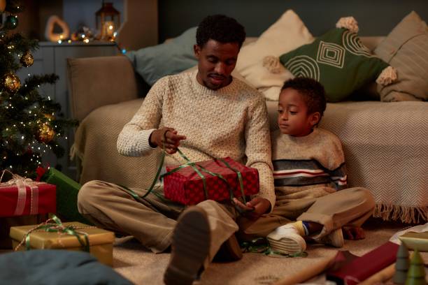 Father and Son Opening Christmas Gifts