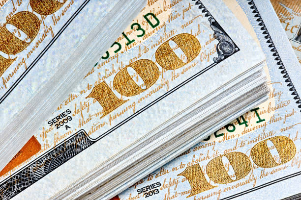 istock New US Dollar USD 2009 series bill bundles background for design. Many bundle of US 100 dollars bank notes. 2183013204