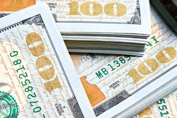 istock New US Dollar USD 2009 series bill bundles background for design. Many bundle of US 100 dollars bank notes. 2183013207