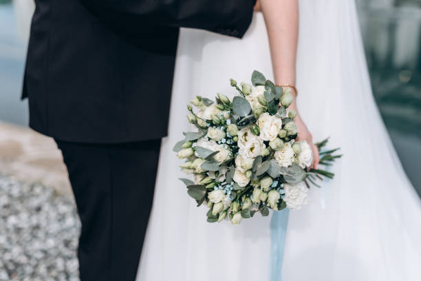 istock bride and groom standing together 2183014234
