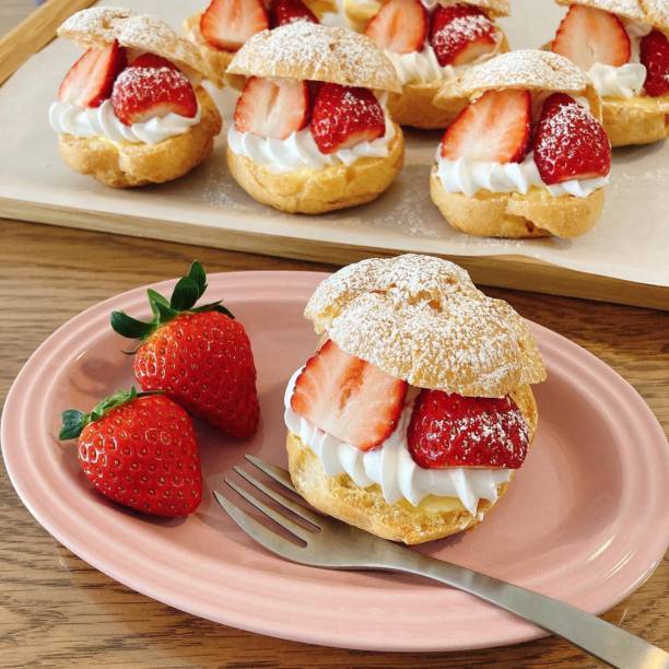 istock freshly baked cream puff cake isolated on white background 2183014273