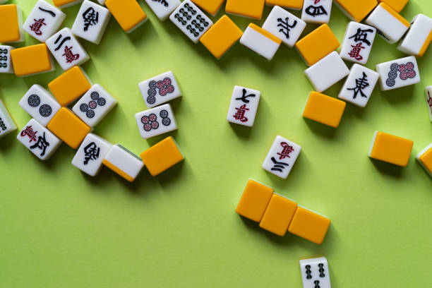 istock Mahjong tiles lined up on a green background 2183016341