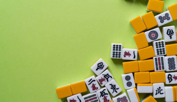 istock Mahjong tiles lined up on a green background 2183016366
